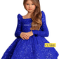 A young girl wearing a royal blue sequined long-sleeve dress with a square neckline and puffed shoulders, photographed against a plain white background. The brand name 'HOUSE OF CLAIRE' is watermarked across the dress and shown in a logo badge in the lower right corner.
www.houseofclaire.com