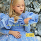 A young girl with blonde hair wearing a sparkly light blue sequined ballgown and a silver headband, posing in front of a decorated Christmas tree. The brand name 'HOUSE OF CLAIRE' is watermarked on the image.
Luxury Lavendar Blue Sparkle Baby Birthday Party Ball Gown Dress by house of Claire.
www.houseofclaire.com
